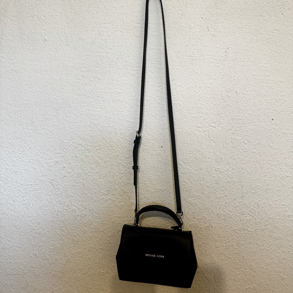 Black small Michael Kors cross body purse.